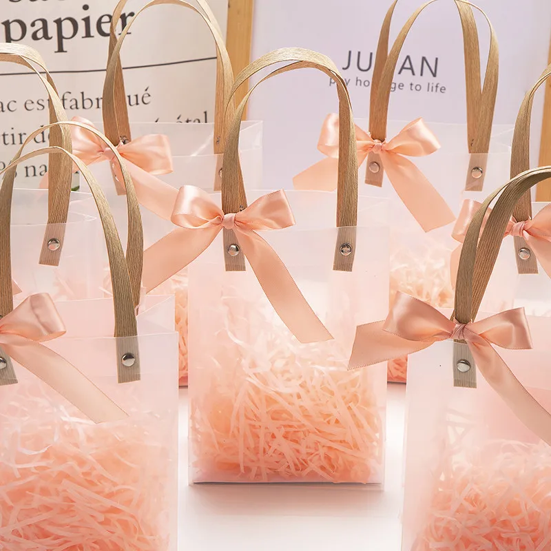 Gift Bag with Bow Ribbon Lafite Grass Wedding Souvenirs for Guests Transparent Candy Boxes Eid Mubarak Bachelorette Party Bags
Gift Bag with Bow Ribbon Lafite Grass Wedding Souvenirs for Guests Transparent Candy Boxes Eid Mubarak Bachelorette Party Bags