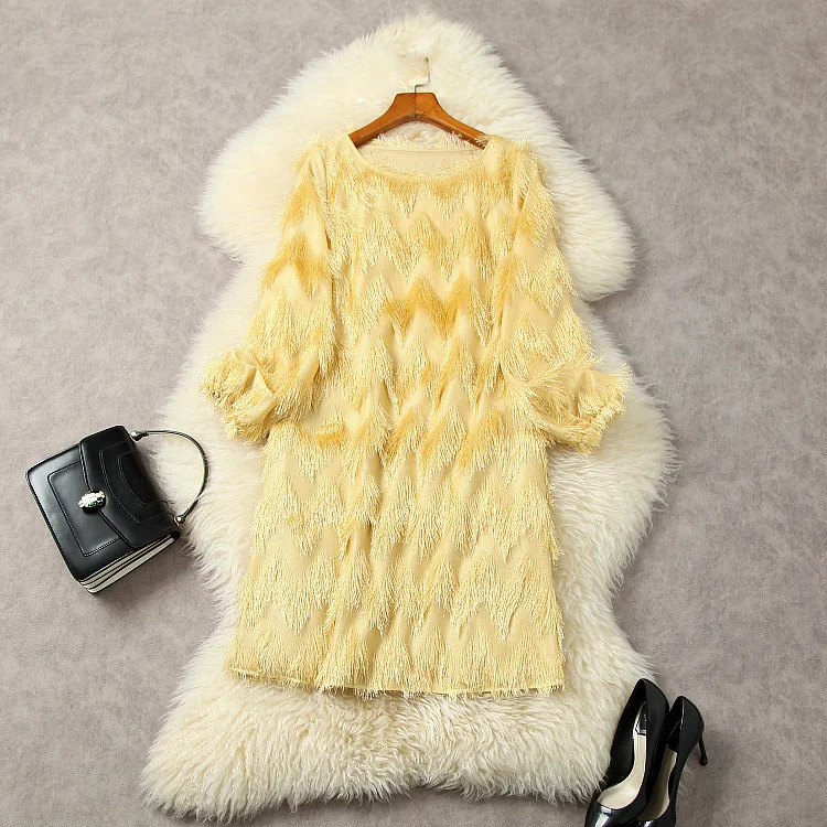 European and American women's clothes 2023 spring new Long sleeve feather tassel Round neck fashion Yellow dress 
European and American women's clothes 2023 spring new Long sleeve feather tassel Round neck fashion Yellow dress