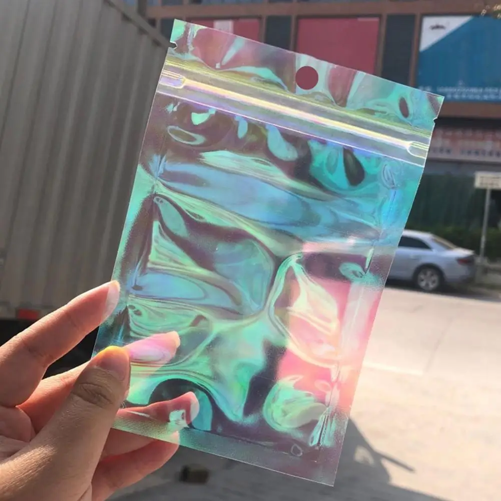 100pcs Translucent Laser Small Jewelry Cosmetic Plastic Package Bag Pink Holographic Gift Bags with Hole
100pcs Translucent Laser Small Jewelry Cosmetic Plastic Package Bag Pink Holographic Gift Bags with Hole
