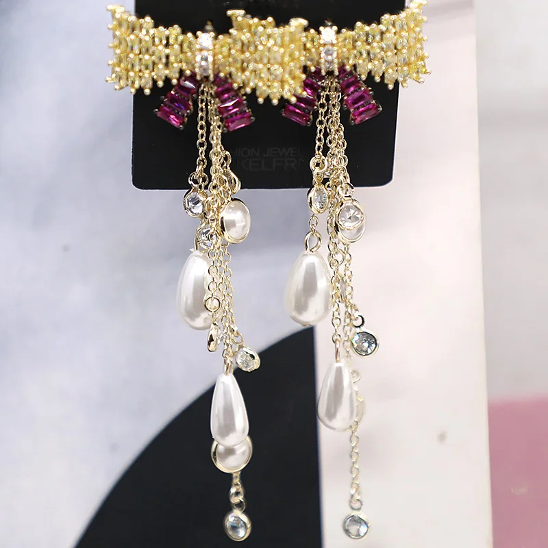 New fashion temperament female earrings European and American handmade micro-inlaid bow pearl water drop tassel earrings
New fashion temperament female earrings European and American handmade micro-inlaid bow pearl water drop tassel earrings