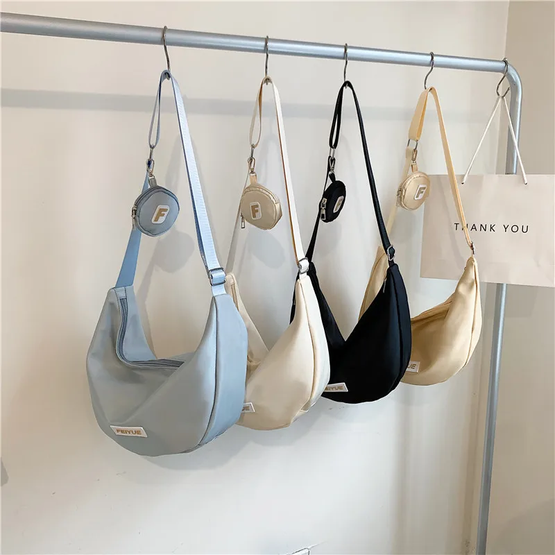 2023 Female Shoulder bags Delicate Niche Nylon Casual Simple Solid color Large capacity Commuter student Crossbody Hobos bags
2023 Female Shoulder bags Delicate Niche Nylon Casual Simple Solid color Large capacity Commuter student Crossbody Hobos bags