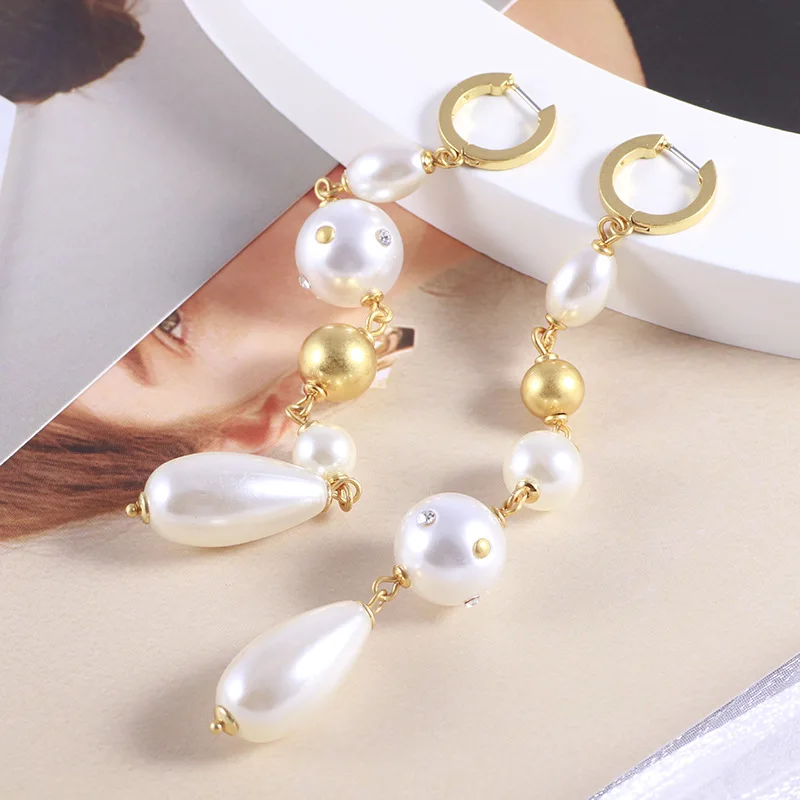 European and American temperament long pearl metal ball tassel drop pendant elegant earrings
European and American temperament long pearl metal ball tassel drop pendant elegant earrings