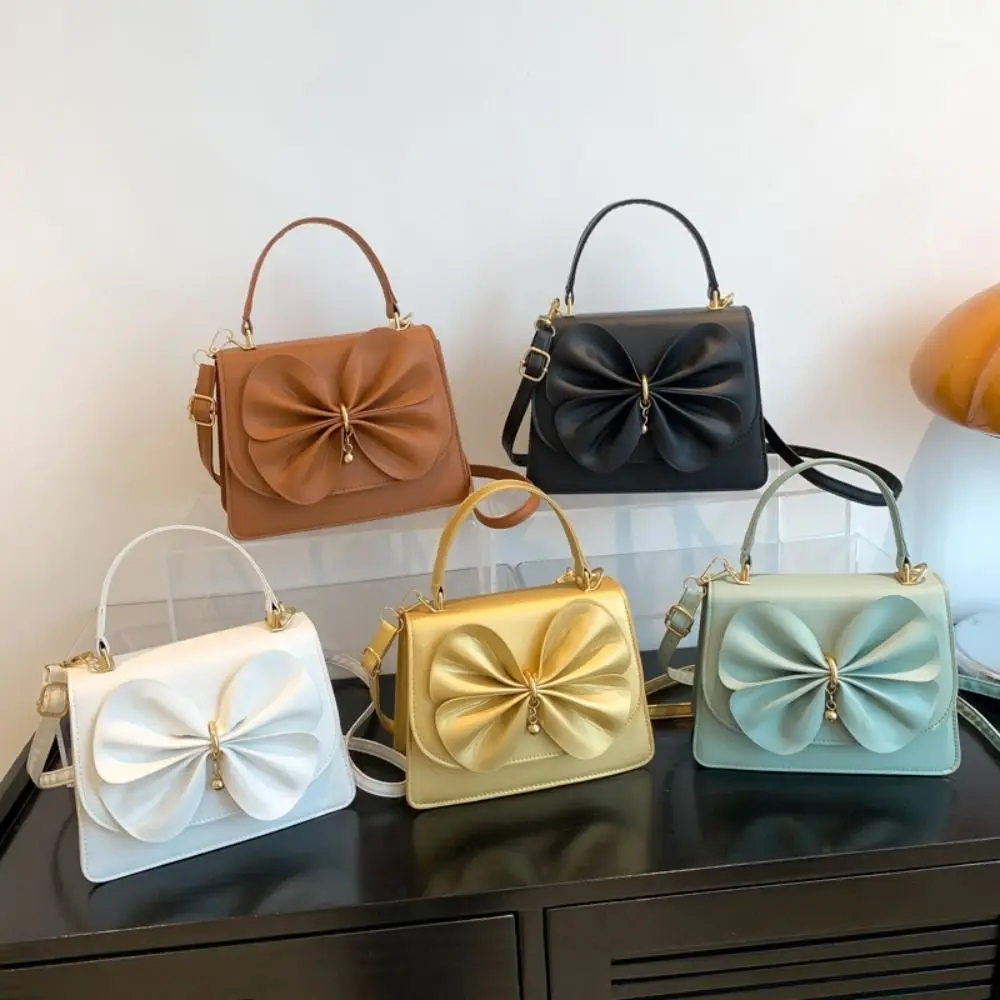 Женская сумка через плечо, с бантом
Женская сумка через плечо, с бантом