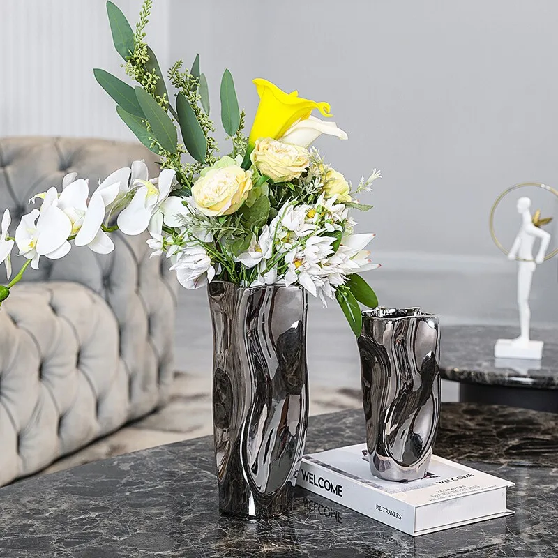 Silver ceramic abstract curved vase simple living room dining table home decorations model room light luxury flower arrangement
Silver ceramic abstract curved vase simple living room dining table home decorations model room light luxury flower arrangement