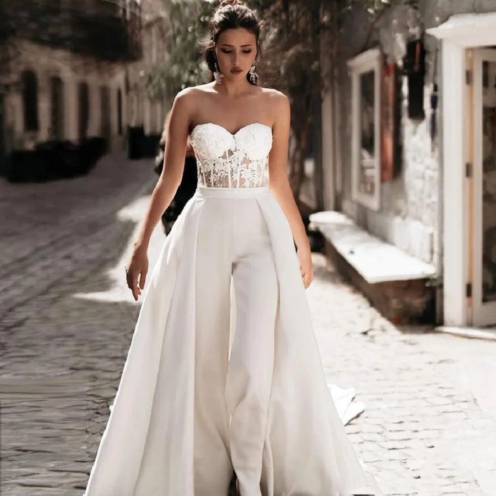 Sweetheart 2 in 1 Satin Jumpsuit Pants Suit Wedding Dresses with Detachable Train Beach Lace Appliques Ivory Elegant Bridal Gown 
Sweetheart 2 in 1 Satin Jumpsuit Pants Suit Wedding Dresses with Detachable Train Beach Lace Appliques Ivory Elegant Bridal Gown