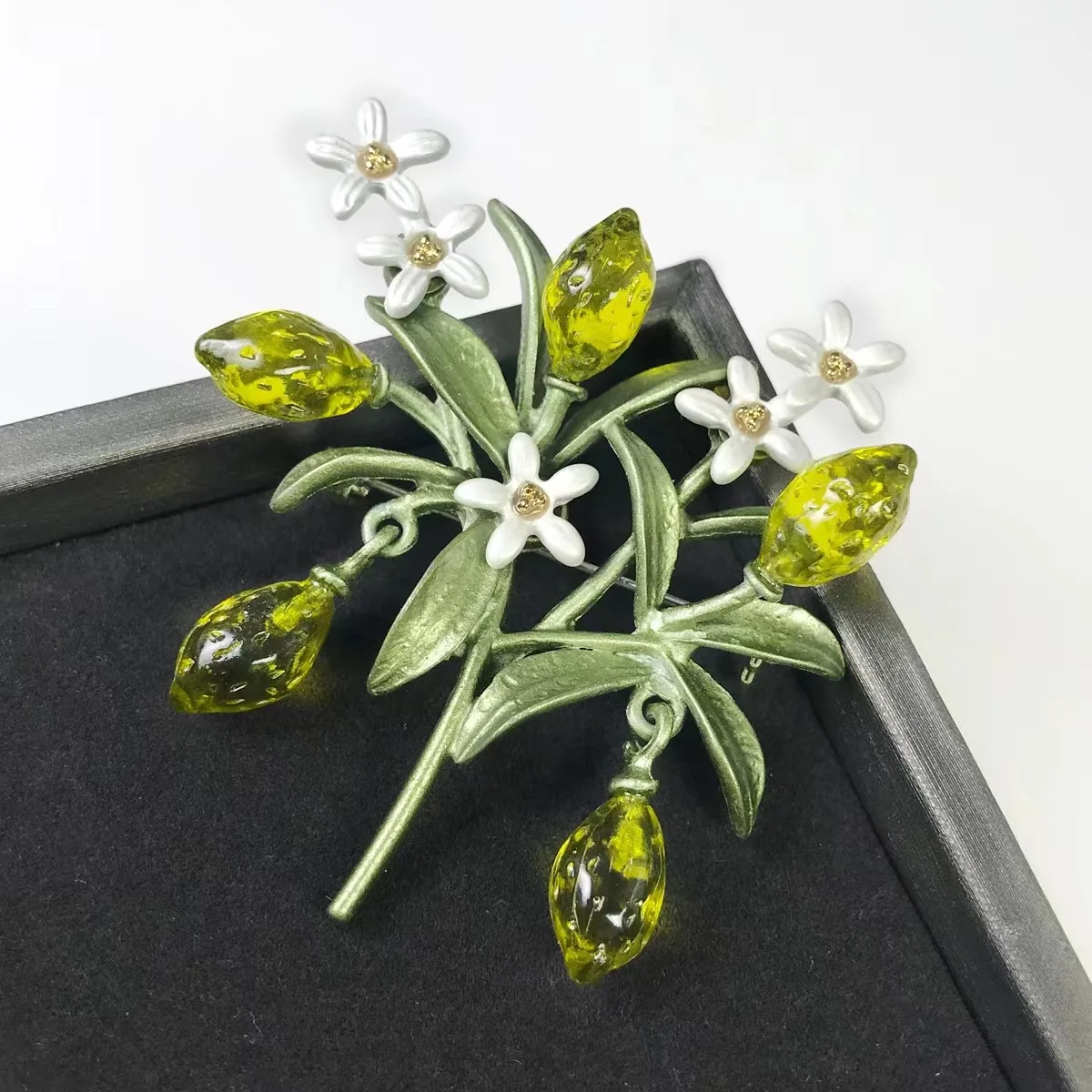SUMMER LEMON BROOCH With Green Lea Flowering Branch with Dangle Fruit Brooch Mother's Day Gift Glaze Fruit Pin Vintage Style
SUMMER LEMON BROOCH With Green Lea Flowering Branch with Dangle Fruit Brooch Mother's Day Gift Glaze Fruit Pin Vintage Style