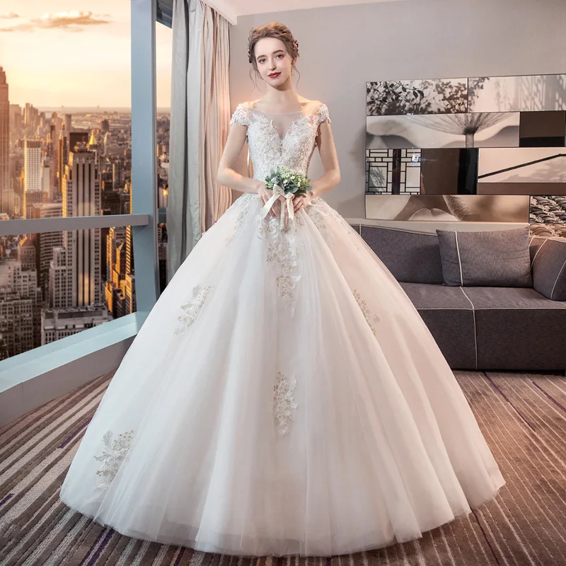 Elegant Wedding Dress Cap Sleeve Lace Tulle Applique Princess Bohemia White Ivory Illusion V Neck Bride Ball Gowns Backless 2022
Elegant Wedding Dress Cap Sleeve Lace Tulle Applique Princess Bohemia White Ivory Illusion V Neck Bride Ball Gowns Backless 2022