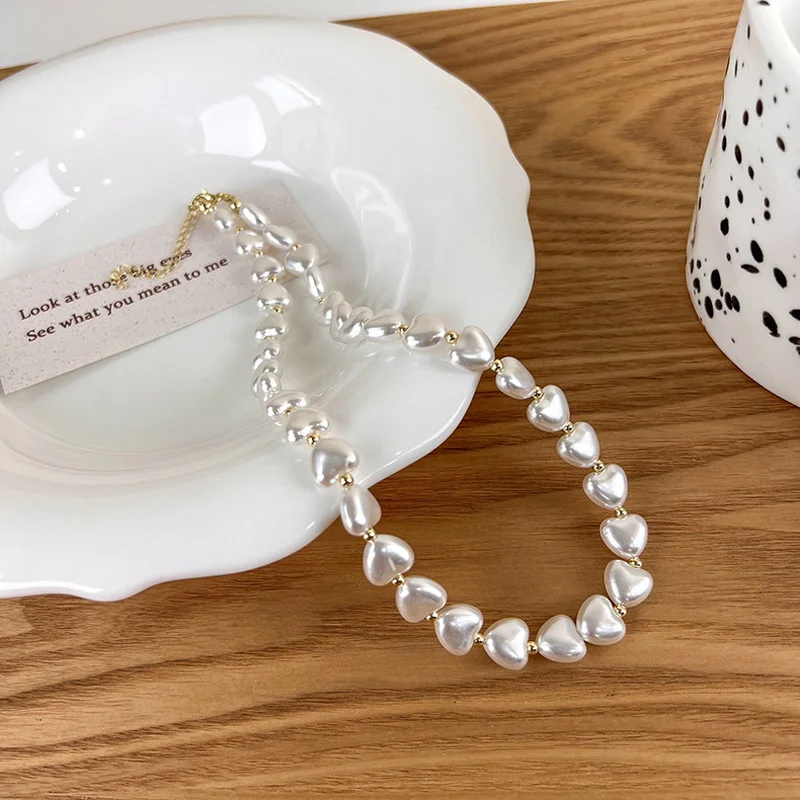 Minar Elegant Love Heart Simulated Pearl Choker Necklace for Women Gold Color Beads Chains Necklaces Korean Wedding Jewellery
Minar Elegant Love Heart Simulated Pearl Choker Necklace for Women Gold Color Beads Chains Necklaces Korean Wedding Jewellery