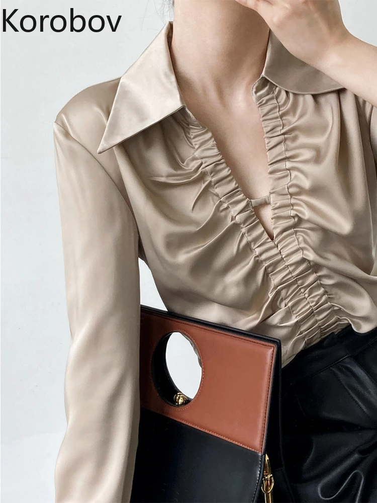 Korobov Autumn New Fashionable Long Sleeves Tops Folds V Neck Hollow Out Solid Blouses Office Lady Blusas Mujer De Moda 2022
Korobov Autumn New Fashionable Long Sleeves Tops Folds V Neck Hollow Out Solid Blouses Office Lady Blusas Mujer De Moda 2022