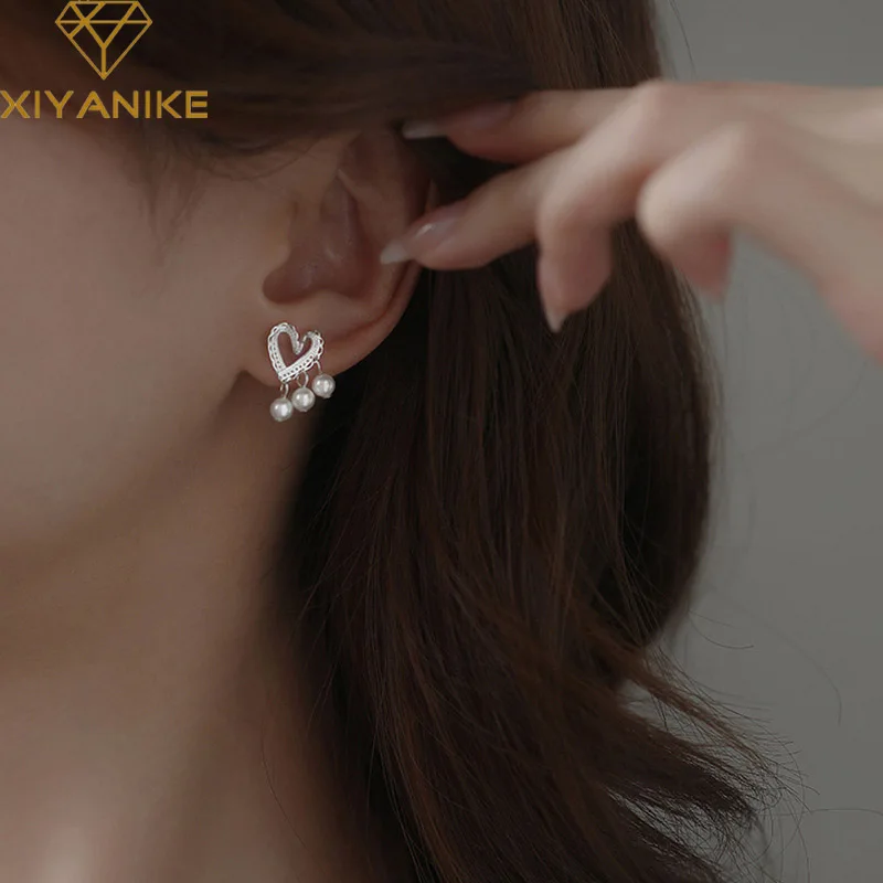 XIYANIKE Luxury Heart Hollow Pearls Stud Earrings For Women Girl New Fashion Trendy Ear Jewelry Accessories сережки женские
XIYANIKE Luxury Heart Hollow Pearls Stud Earrings For Women Girl New Fashion Trendy Ear Jewelry Accessories сережки женские