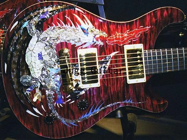 

Reed Dragon Red Flame Maple Top Electric Guitar Abalone Birds Inlay, Wrap Arround Tailpiece, Wood Body Binding, Eagle Headstock
