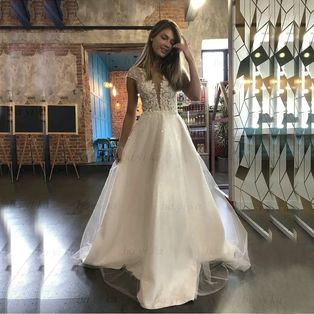Boho V Neck Lace Applique Short Sleeves Wedding Dresses Shiny A Line Princess Brush Train Bridal Gown BAYIKA Robe De Mariée 2022
Boho V Neck Lace Applique Short Sleeves Wedding Dresses Shiny A Line Princess Brush Train Bridal Gown BAYIKA Robe De Mariée 2022