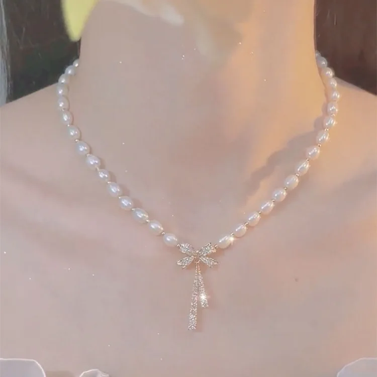 

New Bow Knot Pearl Pendant Necklace Feminine Light Luxury Niche Design Sense Advanced Clavicle Chain