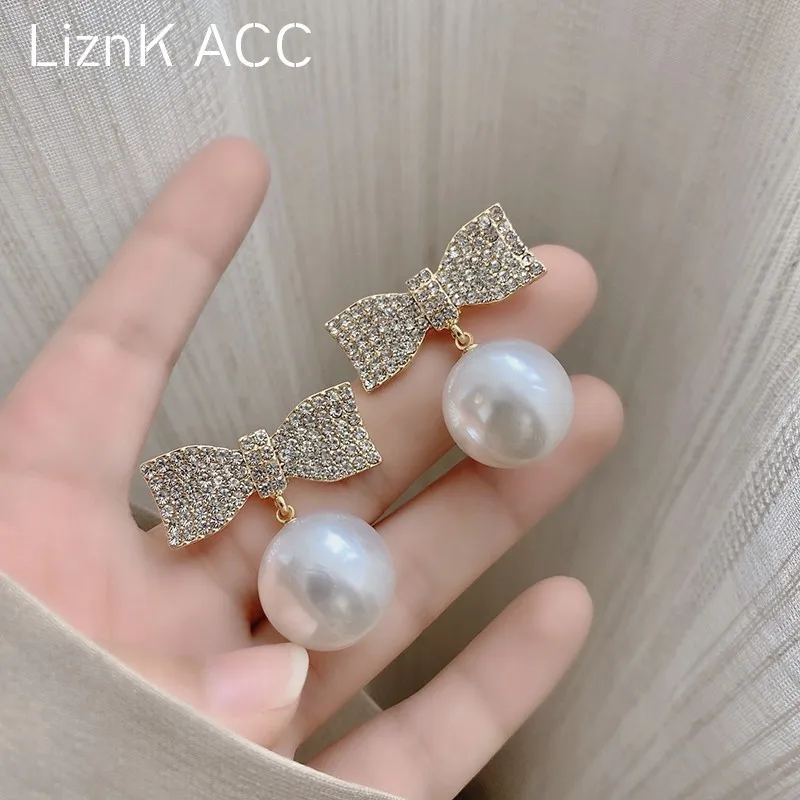 S925 Silver needle Korean bow pearl earrings temperament versatile personality niche design retro earrings women 
S925 Silver needle Korean bow pearl earrings temperament versatile personality niche design retro earrings women