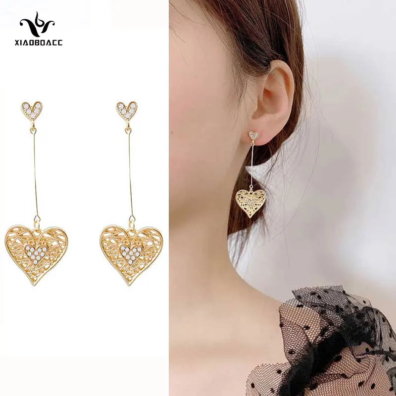 XiaoboACC 925 Silver Needle Love Dangle Earrings for Women Fashion Heart Long Drop Earrings Jewelry Wholesale
XiaoboACC 925 Silver Needle Love Dangle Earrings for Women Fashion Heart Long Drop Earrings Jewelry Wholesale