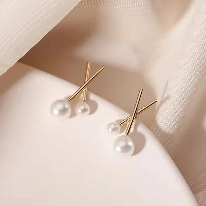 S925 Silver Needle Cross Pearl Earrings Female Korean Simple Earrings Temperament Personality Short Earrings
S925 Silver Needle Cross Pearl Earrings Female Korean Simple Earrings Temperament Personality Short Earrings
