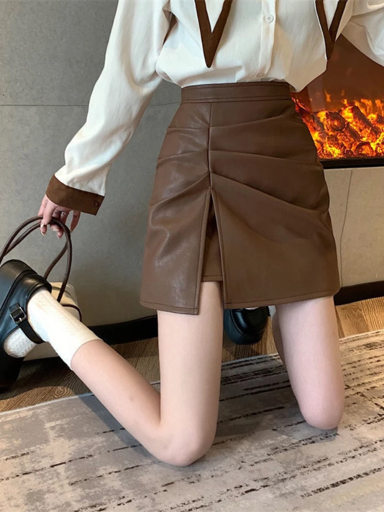 Oversized Pu Leather Skirt Women Solid High-waist Short Skirt 2022 Autumn New Fashion Slim Folds Bag Hip A-Line Half-length 2022
Oversized Pu Leather Skirt Women Solid High-waist Short Skirt 2022 Autumn New Fashion Slim Folds Bag Hip A-Line Half-length 2022