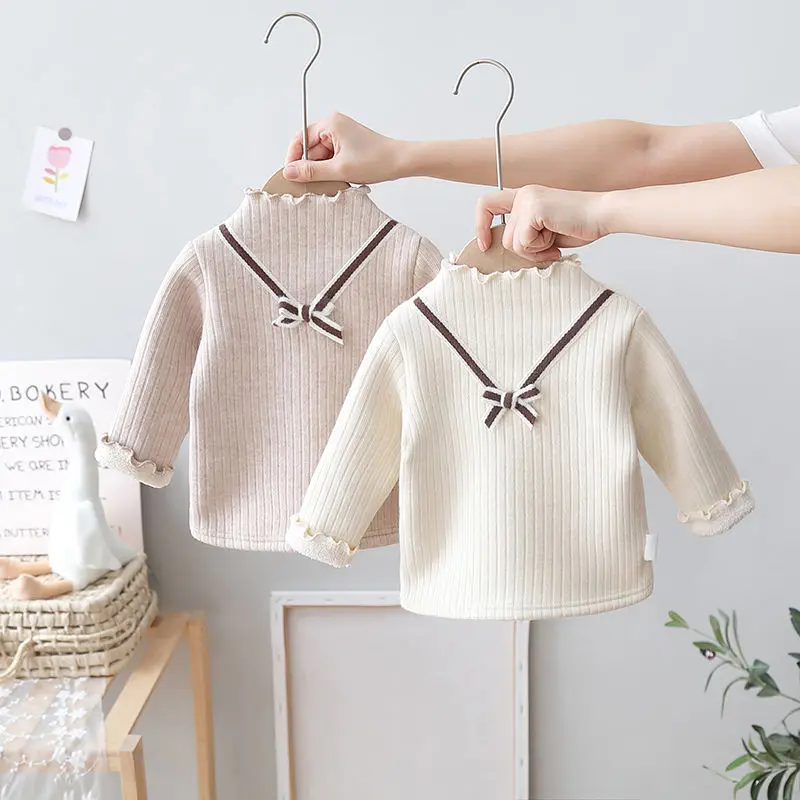 Girls' Plush Bottoming Shirt Western Style Autumn Winter New Girls' Bow Knit Sweater Children's All-in-one Velvet Top Sweaters
Girls' Plush Bottoming Shirt Western Style Autumn Winter New Girls' Bow Knit Sweater Children's All-in-one Velvet Top Sweaters