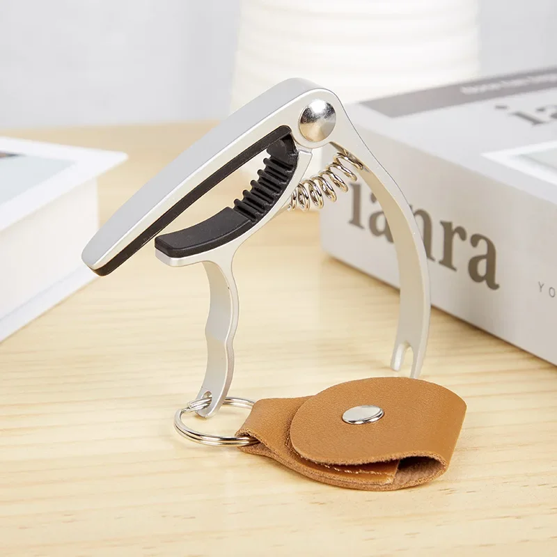 Guitar Capo with Pick Bag Multifunctional Capo Ukulele Capo Removable String Nail Capo Guitar Accessories
Guitar Capo with Pick Bag Multifunctional Capo Ukulele Capo Removable String Nail Capo Guitar Accessories