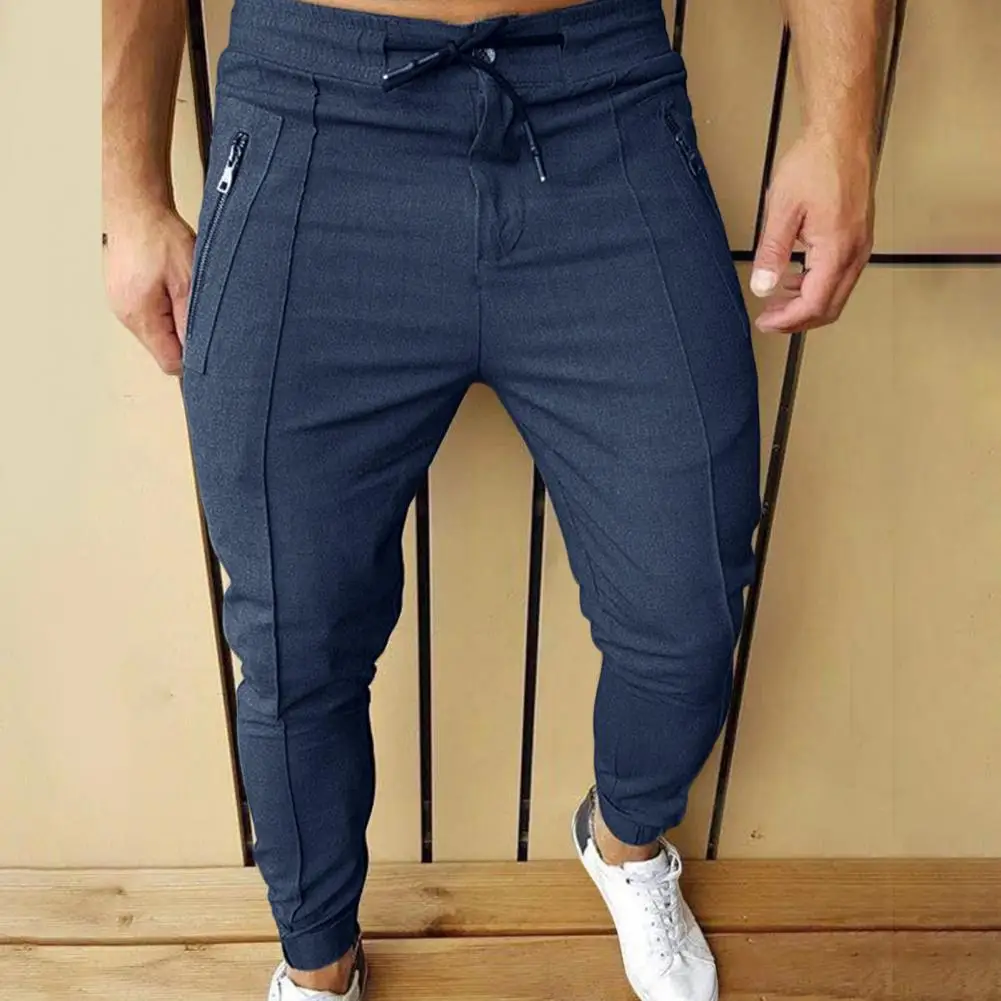 Casual Men Pants Solid Color Drawstring Elastic Waist Zipper Pockets Ankle Tied Trousers Spring Autumn Slim Pencil Pants
Casual Men Pants Solid Color Drawstring Elastic Waist Zipper Pockets Ankle Tied Trousers Spring Autumn Slim Pencil Pants