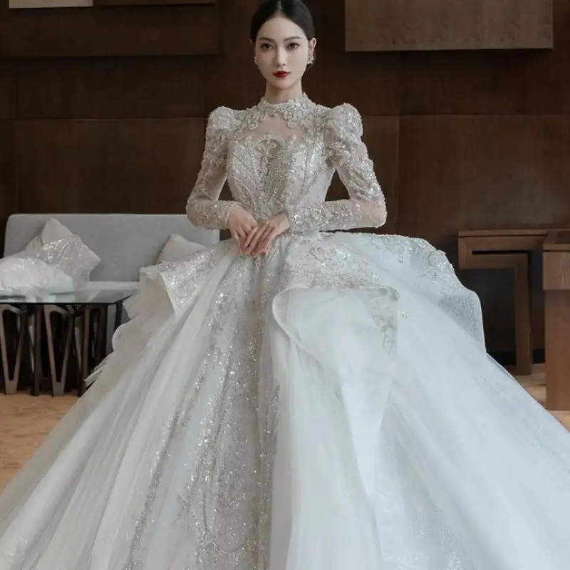 Long Sleeve Wedding Dress High Neck Backless Bride Dress Sexy Luxury Blingbling Wedding Gowns Plus Size Suknia Slubna
Long Sleeve Wedding Dress High Neck Backless Bride Dress Sexy Luxury Blingbling Wedding Gowns Plus Size Suknia Slubna
