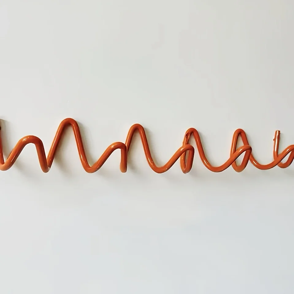 Настенная вешалка из нержавеющей стали волнистого дизайна
Настенная вешалка из нержавеющей стали волнистого дизайна