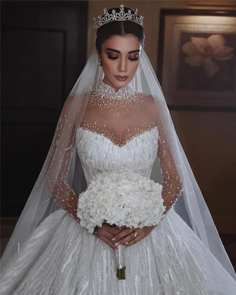 Vestido novia 2022 Princess Luxury Wedding Dress Beaded High Neck Illusion Long Sleeve Puffy Skirt Arabic Bridal Gown
Vestido novia 2022 Princess Luxury Wedding Dress Beaded High Neck Illusion Long Sleeve Puffy Skirt Arabic Bridal Gown
