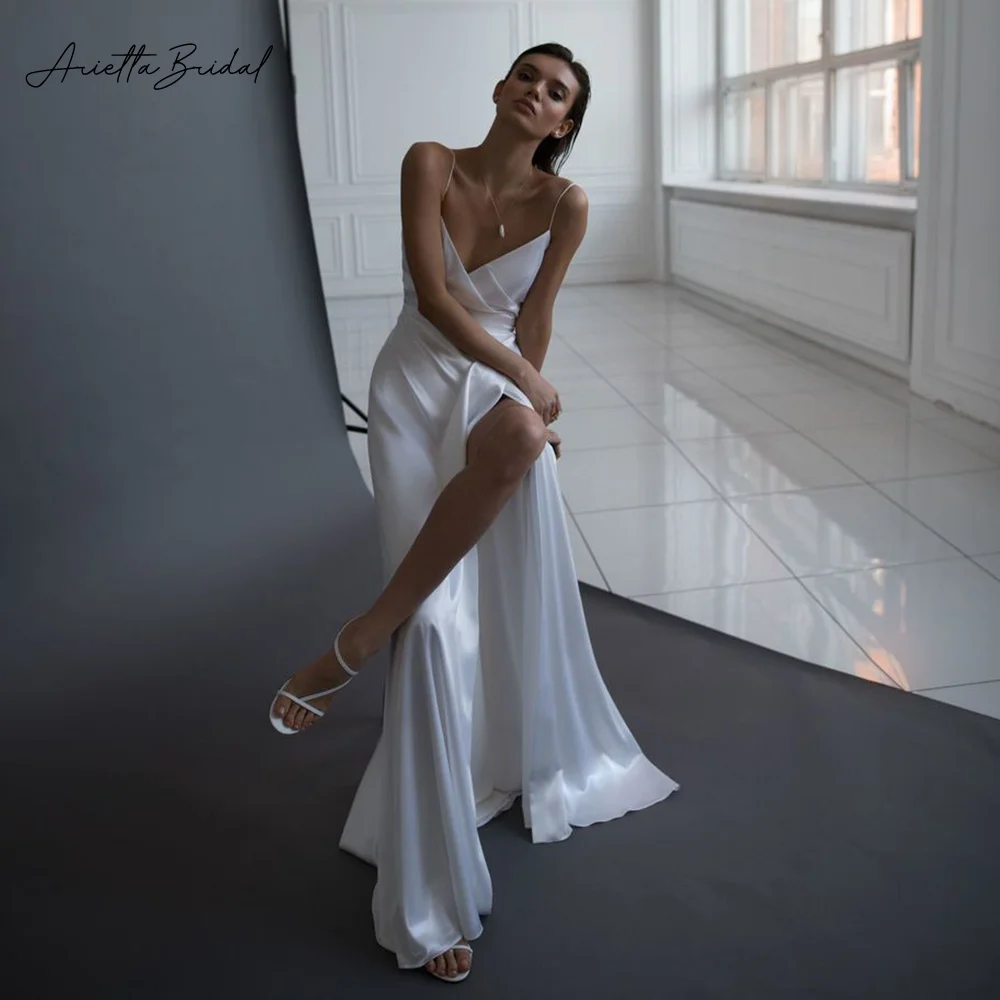 Arietta Simple Soft Satin Long Wedding Dresses V-Neck Spaghetti Straps High Slit A-Line Bride Dresses 2023 Modern Wedding Gowns
Arietta Simple Soft Satin Long Wedding Dresses V-Neck Spaghetti Straps High Slit A-Line Bride Dresses 2023 Modern Wedding Gowns