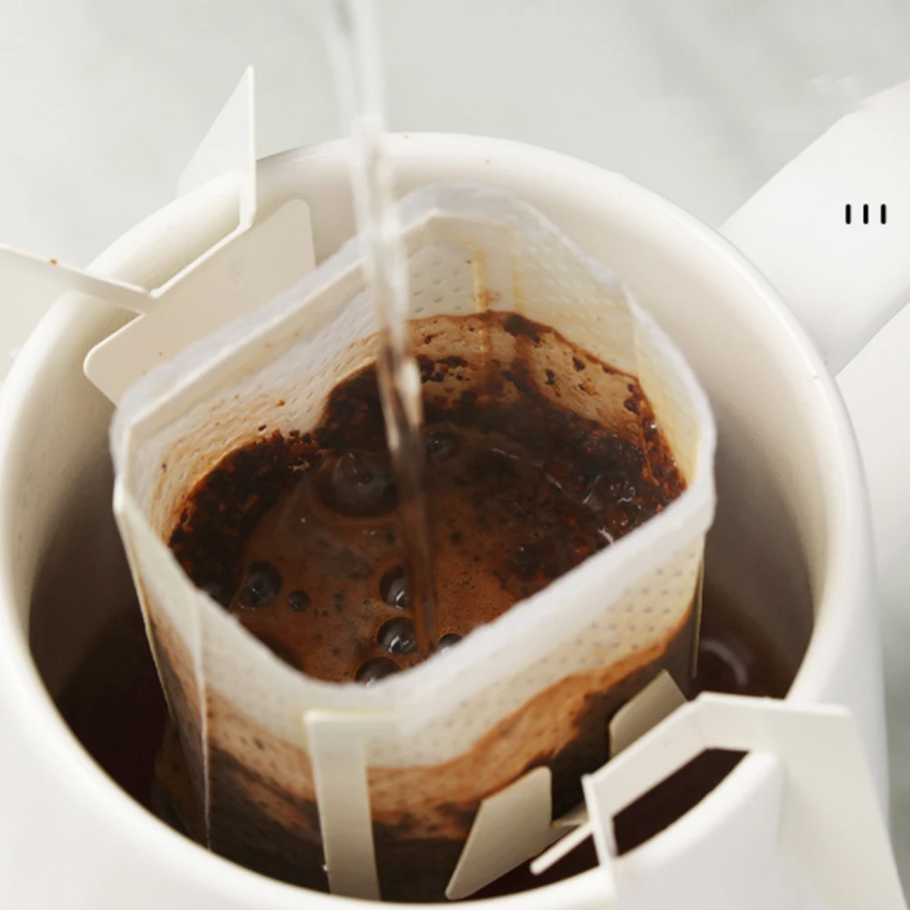 50Pcs/Pack Disposable Coffee Fliter Bags Portable Hanging Ear Style Coffee Filters Eco-Friendly Paper Bag For Espresso Coffee
50Pcs/Pack Disposable Coffee Fliter Bags Portable Hanging Ear Style Coffee Filters Eco-Friendly Paper Bag For Espresso Coffee
