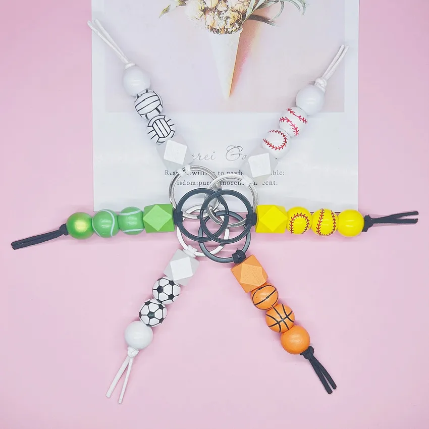 New Sport Keychains Basketball Soccer Tennis Baseball Volleyball Keychain Wooden Beads Printed String Charm Women Men Keyrings
New Sport Keychains Basketball Soccer Tennis Baseball Volleyball Keychain Wooden Beads Printed String Charm Women Men Keyrings
