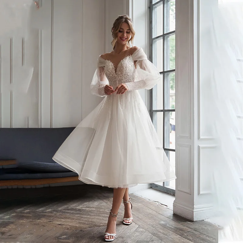 Sheer Illusio Off The Shoulder Lace Applique Tea Length Short Wedding Dresses With Detachable Puff Sleeves Button Back Robe De 
Sheer Illusio Off The Shoulder Lace Applique Tea Length Short Wedding Dresses With Detachable Puff Sleeves Button Back Robe De