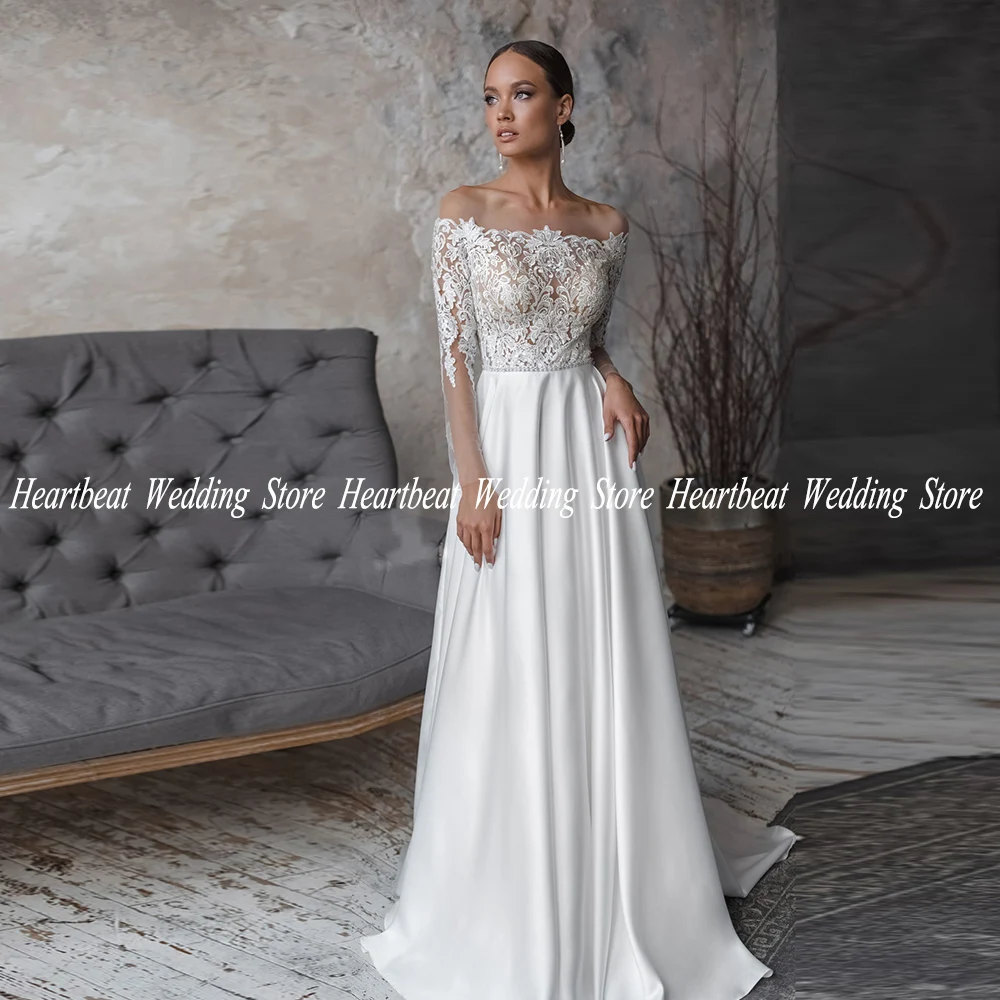 Elegant Satin White Wedding Dress For Bride Sheer Lace Boat Neck Long Sleeve Bridal Gown Button Back A Line LVestidos De Novia
Elegant Satin White Wedding Dress For Bride Sheer Lace Boat Neck Long Sleeve Bridal Gown Button Back A Line LVestidos De Novia
