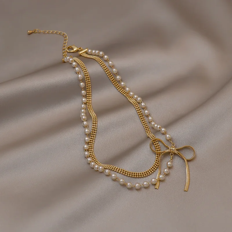Classic Metal Bow Pendant Luxury Pearl Necklace for Women Double Chains Style Fashion Jewelry Gift Accessories Choker Gift
Classic Metal Bow Pendant Luxury Pearl Necklace for Women Double Chains Style Fashion Jewelry Gift Accessories Choker Gift