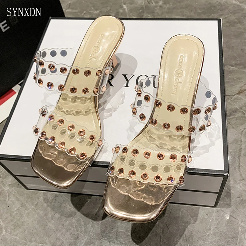 SYNXDN Transparent PVC Women Slingbacks Sandals Open Toe Summer Slippers High Heels Gold Flip Flops 
SYNXDN Transparent PVC Women Slingbacks Sandals Open Toe Summer Slippers High Heels Gold Flip Flops