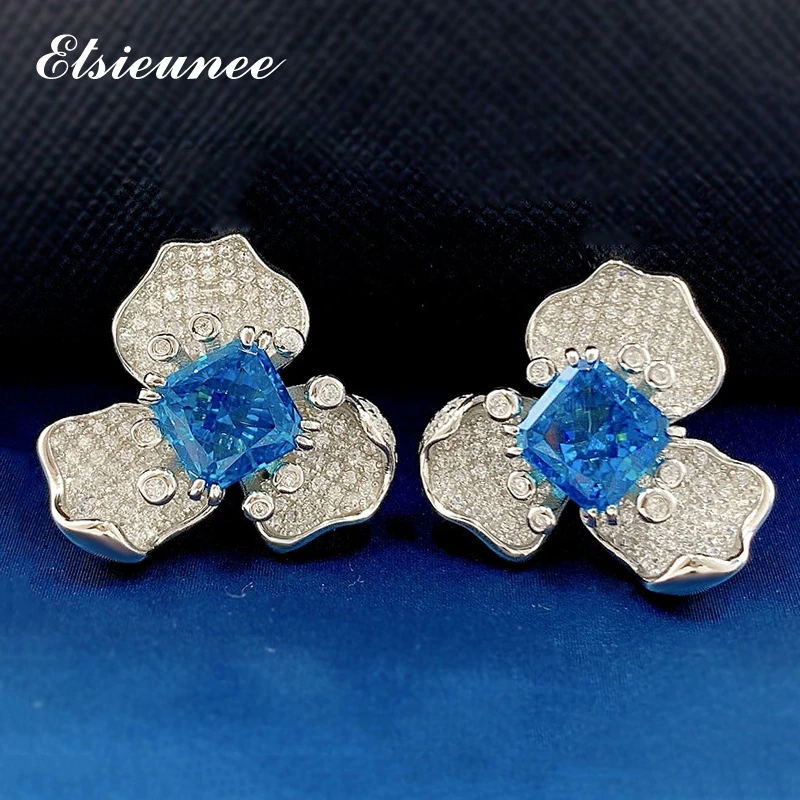 ELSIEUNEE 100% 925 Sterling Silver Flower Aquamarine Simulated Moissanite Anniversary Ear Stud Earrings for Women Fine Jewelry
ELSIEUNEE 100% 925 Sterling Silver Flower Aquamarine Simulated Moissanite Anniversary Ear Stud Earrings for Women Fine Jewelry