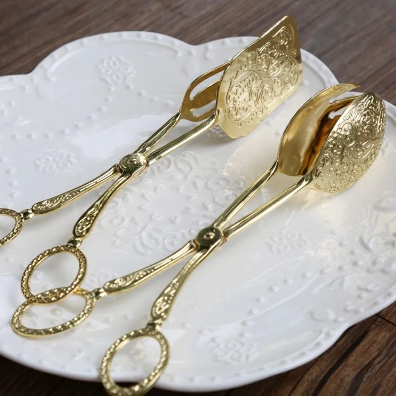 Щипцы для еды, позолоченный зажим для закусок, тортов, салата, хлеба, кондитерский зажим, инструмент для выпечки, барбекю, кухонная утварь с зажимом для фруктов
Щипцы для еды, позолоченный зажим для закусок, тортов, салата, хлеба, кондитерский зажим, инструмент для выпечки, барбекю, кухонная утварь с зажимом для фруктов
