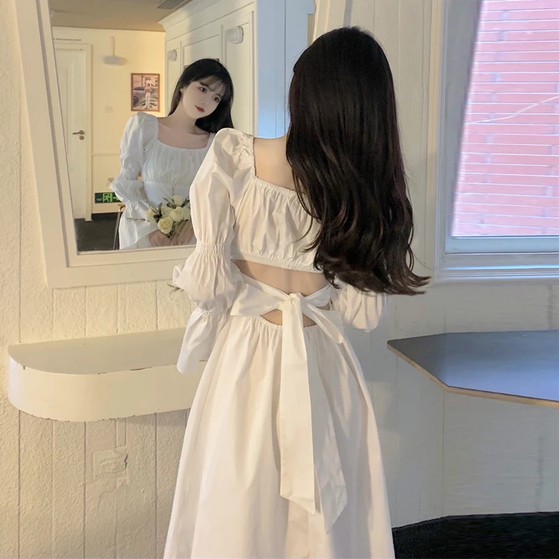 French lady style white waist dress summer new design feeling back hollow bow medium length skirt 
French lady style white waist dress summer new design feeling back hollow bow medium length skirt