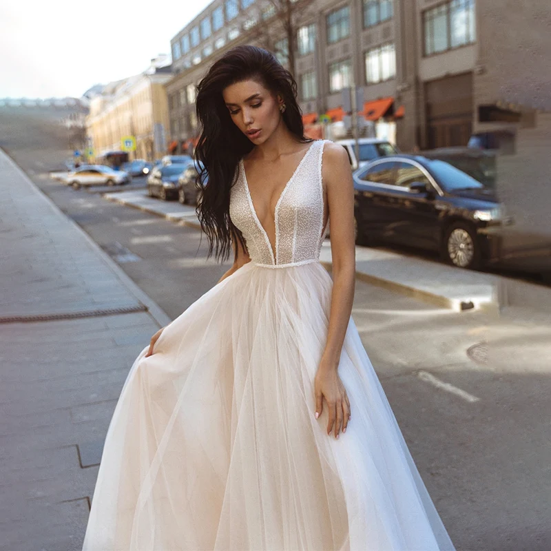 Mordern Deep V-Neck A-Line Wedding Dress Spaghetti Straps Shiny Glitter Floor Length Bridal Gowns Vestidos De Noiva 
Mordern Deep V-Neck A-Line Wedding Dress Spaghetti Straps Shiny Glitter Floor Length Bridal Gowns Vestidos De Noiva
