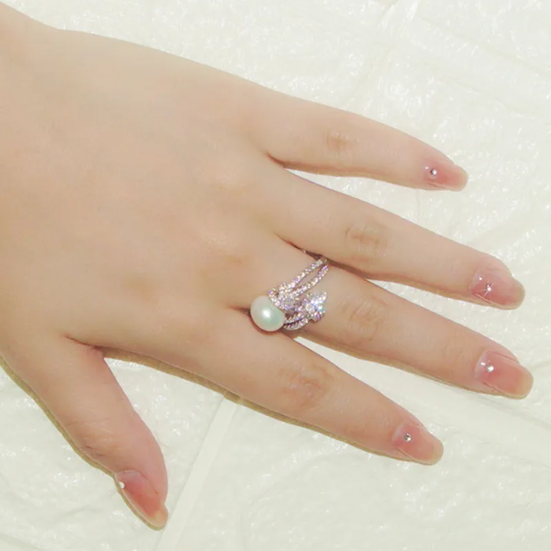 Изысканное кольцо из серебра S925 пробы с цирконом и жемчугом Shijia, регулируемое кольцо с женским дизайном меньшего роста, BVR29
Изысканное кольцо из серебра S925 пробы с цирконом и жемчугом Shijia, регулируемое кольцо с женским дизайном меньшего роста, BVR29