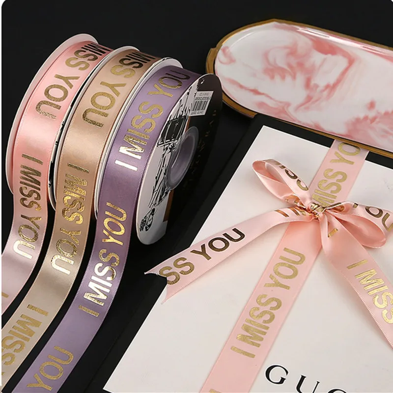 5-10 Yard Printed Bronzing Miss You Ribbon Wedding Party Gift Bouquet Packaging Material Decoration Bow Crafts Accessories 2.5cm
5-10 Yard Printed Bronzing Miss You Ribbon Wedding Party Gift Bouquet Packaging Material Decoration Bow Crafts Accessories 2.5cm