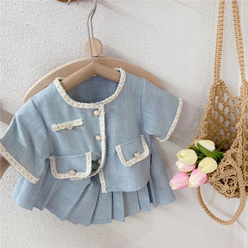 2023 Spring and Summer New Girls' Set Baby blue O-Neck Small Fragrant Short Sleeve Top and Pleated Skirt two-piece set
2023 Spring and Summer New Girls' Set Baby blue O-Neck Small Fragrant Short Sleeve Top and Pleated Skirt two-piece set