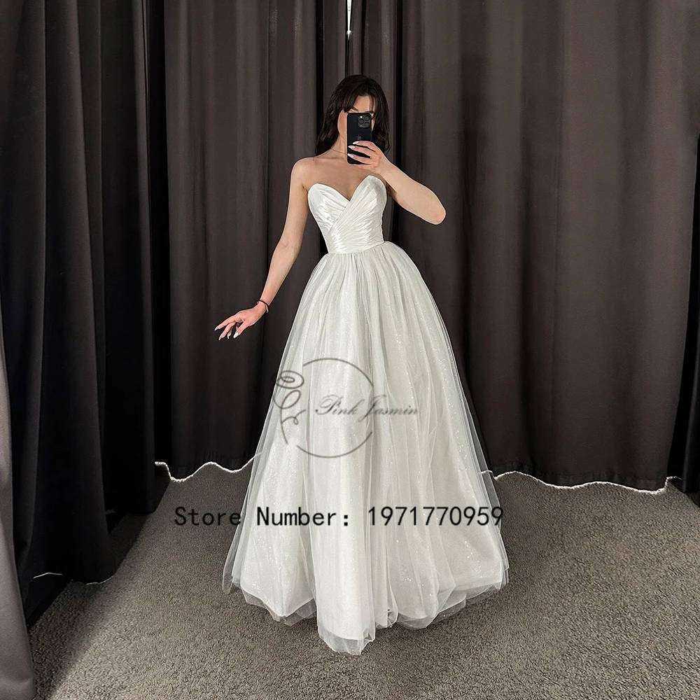 Gorgerous V Neck Strapless White Wedding Dresses For Bride Sleeveless 2023 New Glitter Court Train Bridal Gowns With Soft Tulle
Gorgerous V Neck Strapless White Wedding Dresses For Bride Sleeveless 2023 New Glitter Court Train Bridal Gowns With Soft Tulle