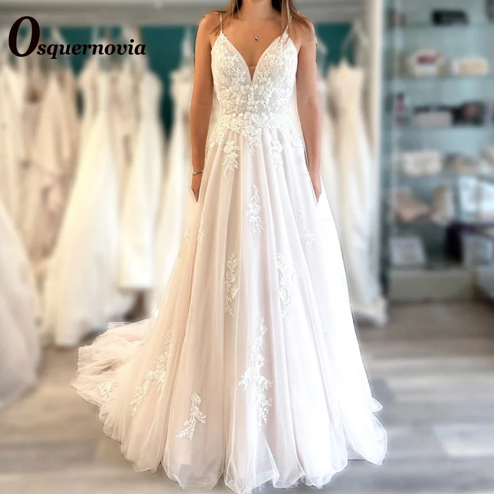 Osquernovia Charming Wedding Dresses Spaghetti Straps V-neck Appliques Backless A-line Beads Sweep Train Vestido De Noiva 2023
Osquernovia Charming Wedding Dresses Spaghetti Straps V-neck Appliques Backless A-line Beads Sweep Train Vestido De Noiva 2023