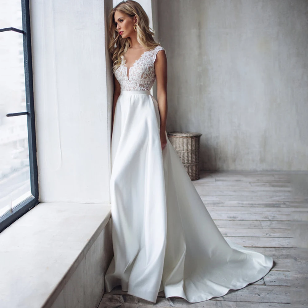 Modern Applique Sleeveless Wedding Dress A-Line Floor Length Sexy Open Back Bridal Sweep Train for Formal Marriage Bride Gowns 
Modern Applique Sleeveless Wedding Dress A-Line Floor Length Sexy Open Back Bridal Sweep Train for Formal Marriage Bride Gowns