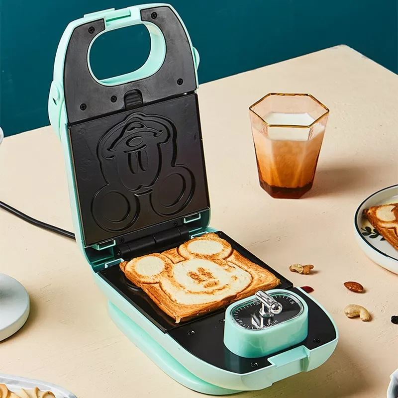 220V 650w Automatic Sandwich breakfast machine Cartoon Bakeware Waffle Maker Non-stick coating Timing Bread machine
220V 650w Automatic Sandwich breakfast machine Cartoon Bakeware Waffle Maker Non-stick coating Timing Bread machine