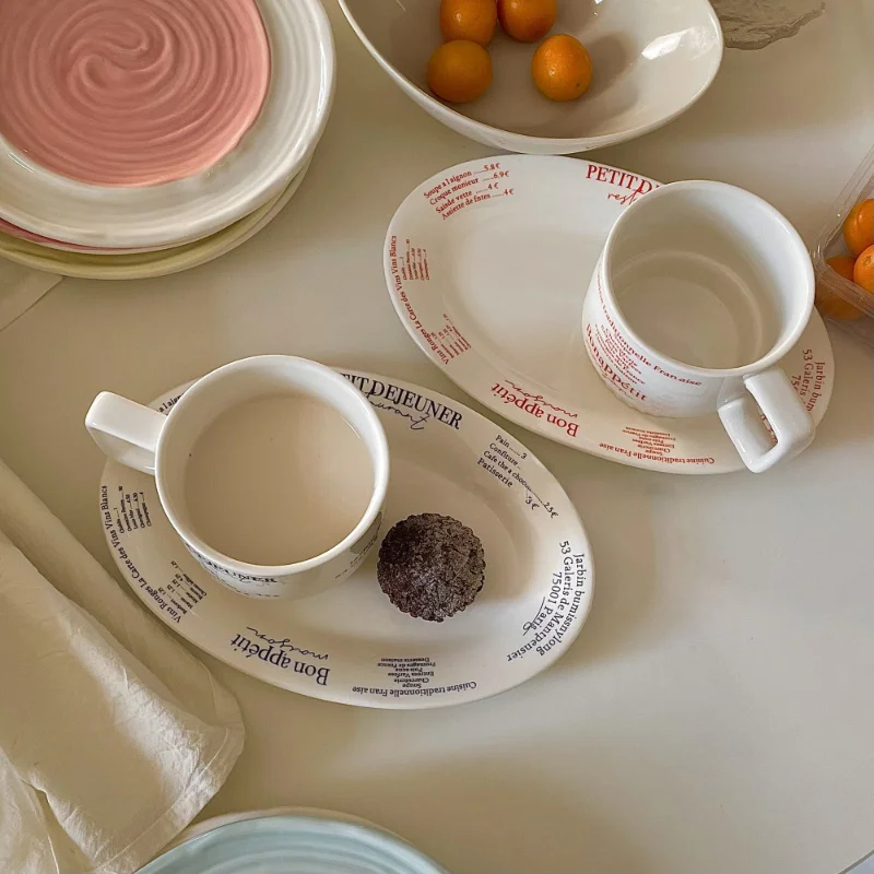 Ceramic Tableware French Letter Coffee Cup Plate Photo Simple Good-looking Tableware Household Tableware Gift Reakfast Milk Cup
Ceramic Tableware French Letter Coffee Cup Plate Photo Simple Good-looking Tableware Household Tableware Gift Reakfast Milk Cup