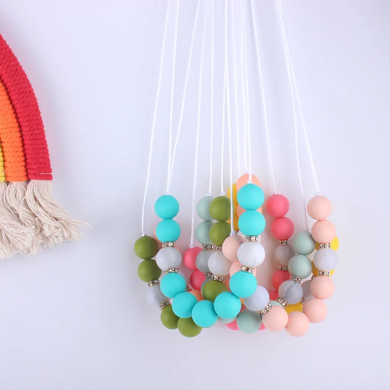 Silicone wood nursing necklace with satin feel nylon cord safety clasp for breastfeeding black and white geometric baby shower 
Silicone wood nursing necklace with satin feel nylon cord safety clasp for breastfeeding black and white geometric baby shower