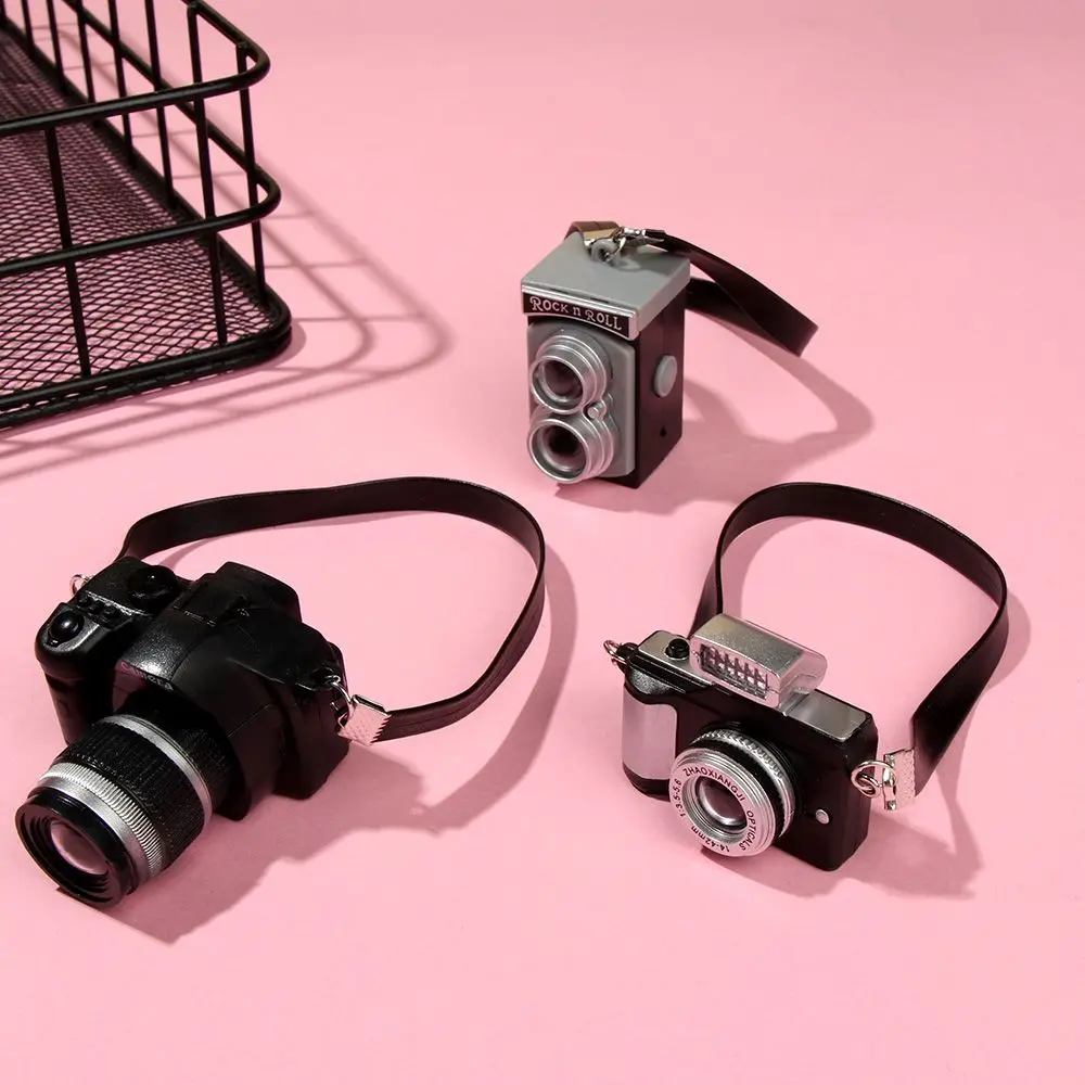 

Аксессуары для кукольного домика масштаб 1:12 мини SLR цифровая камера модель затвора и мигающая миниатюрная кукольная камера с черным ремнем