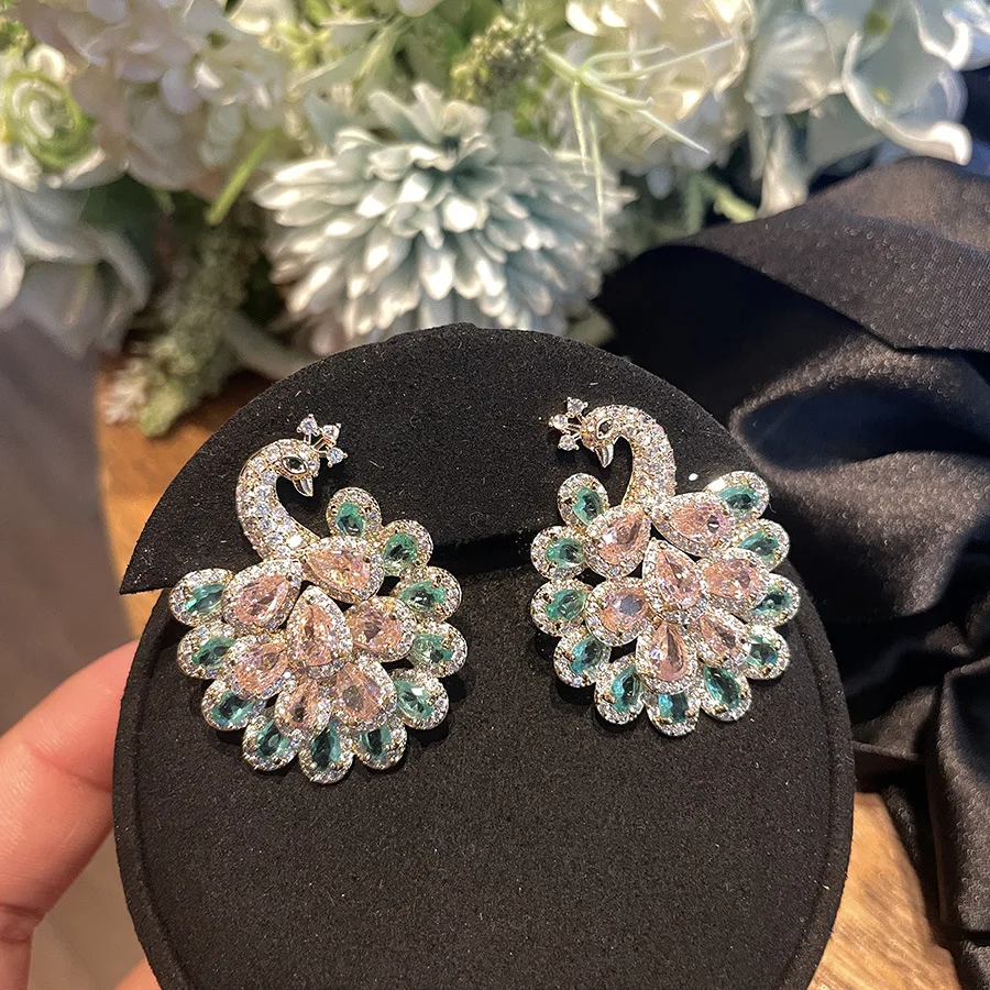 2023 Women S925 Silver Needle Full Zirconium Colored Peacock Open Screen Retro Earrings
2023 Women S925 Silver Needle Full Zirconium Colored Peacock Open Screen Retro Earrings