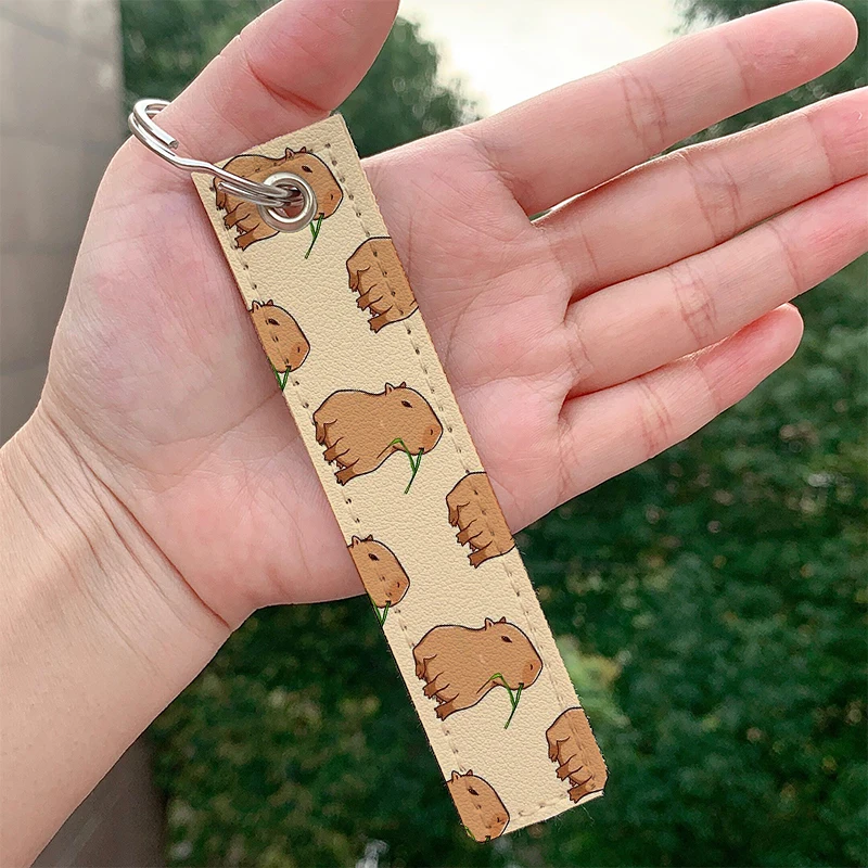 Fashion Capybara Capybara with a leaf Keychain Strap Keyrings Hanging Holder Bag Car Wallet Trinket Keychain Hanging Decoration
Fashion Capybara Capybara with a leaf Keychain Strap Keyrings Hanging Holder Bag Car Wallet Trinket Keychain Hanging Decoration
